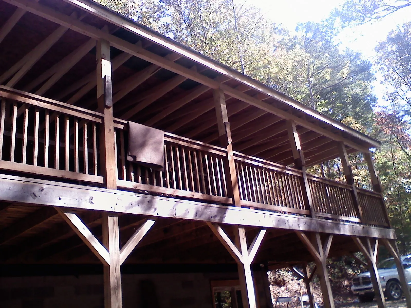 Timber framing under a new elevated porch and deck in Mullan